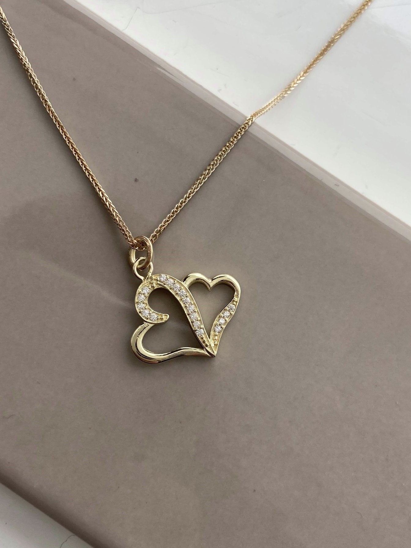 Pendentif cœur en or avec pierres